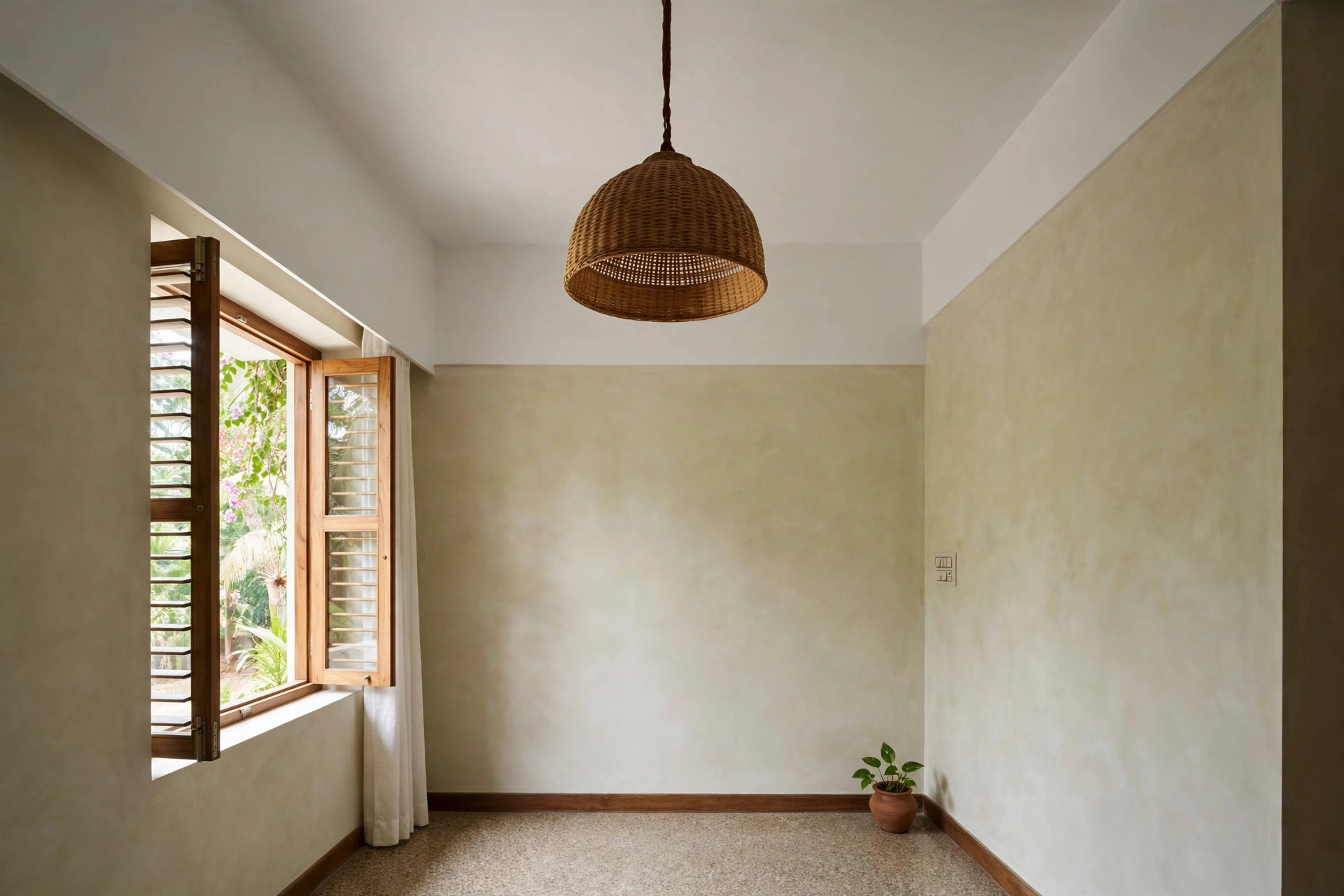 Single woven pendant light hanging from a plain white bedroom ceiling