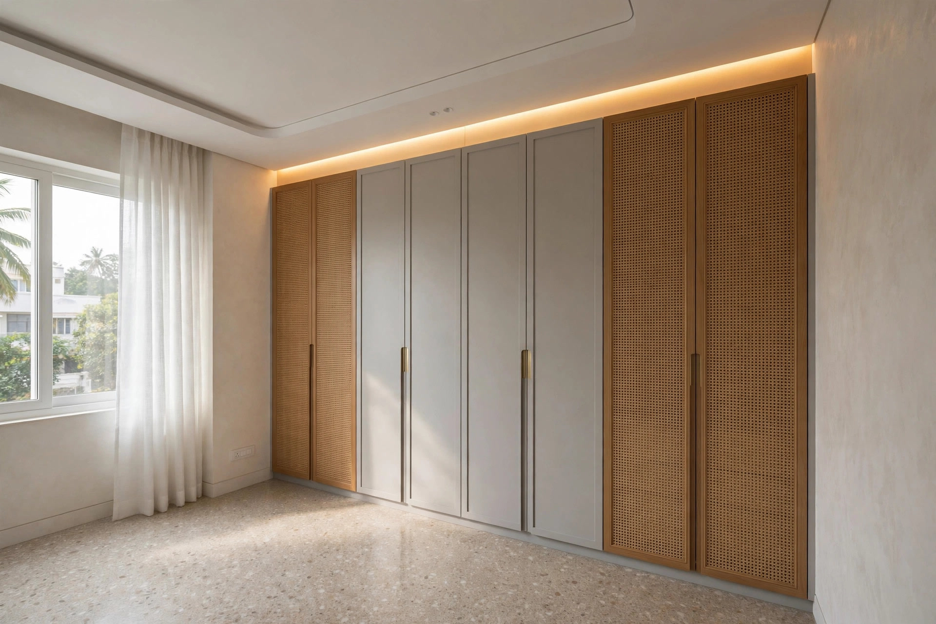 Wardrobe meeting a false ceiling with a slim cove light along the joint