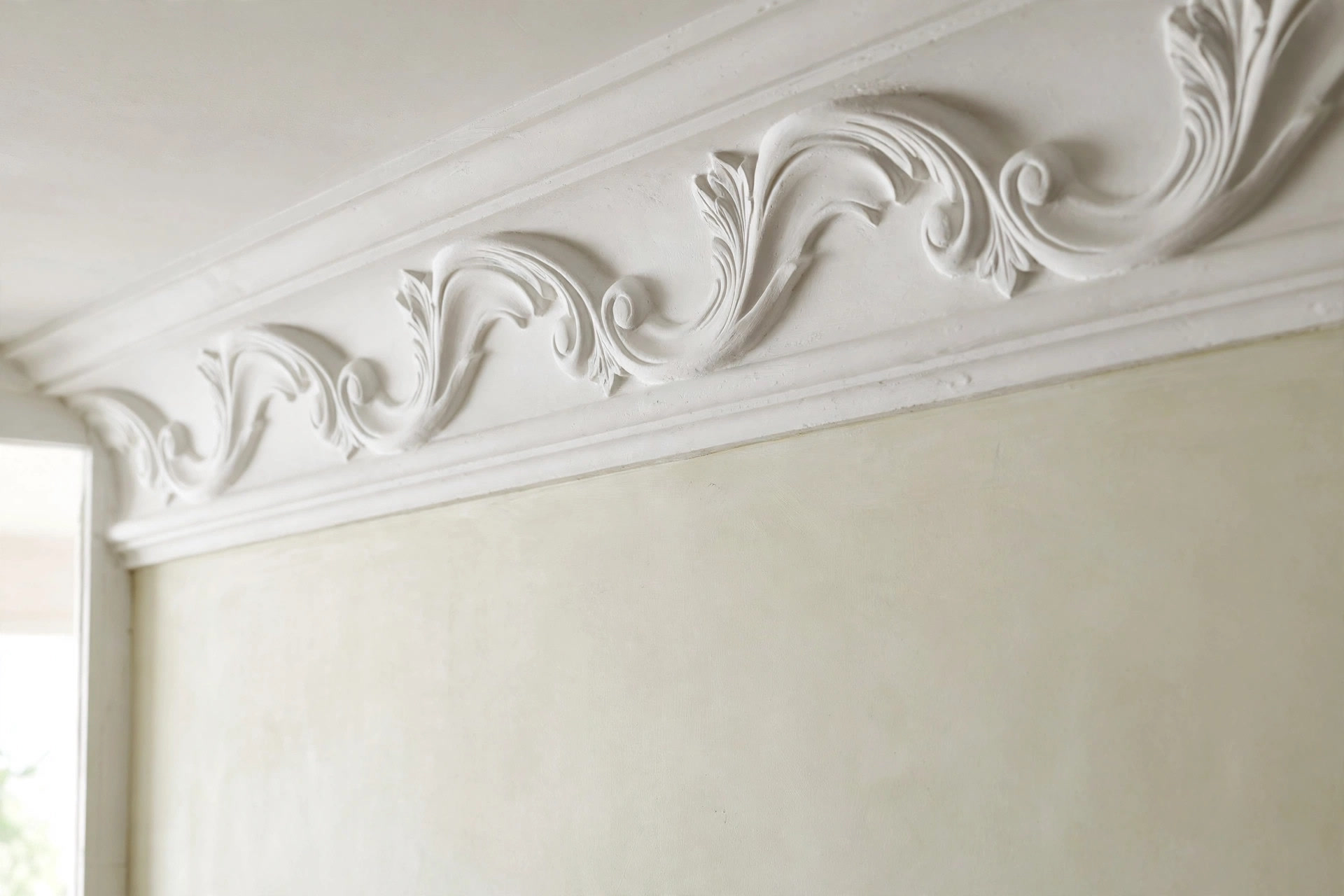 POP cornice detail running along the junction of a bedroom wall and ceiling