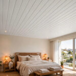 Master bedroom with a clean white PVC panel false ceiling