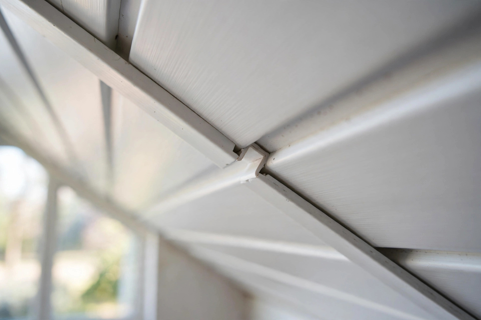 Close-up showing the visible joints between PVC ceiling panels