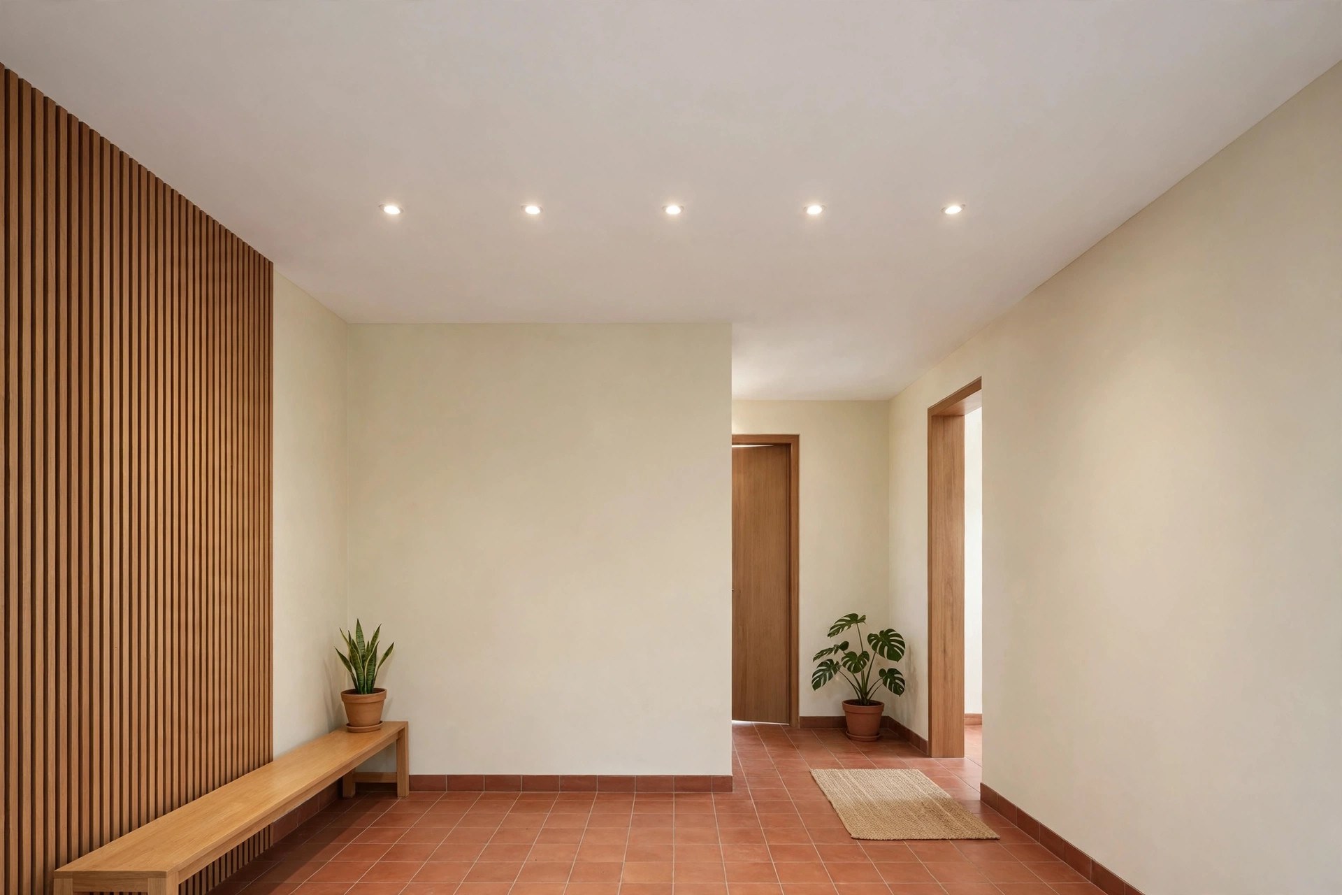 Small hall where a structural beam is concealed by a shallow false ceiling at beam level