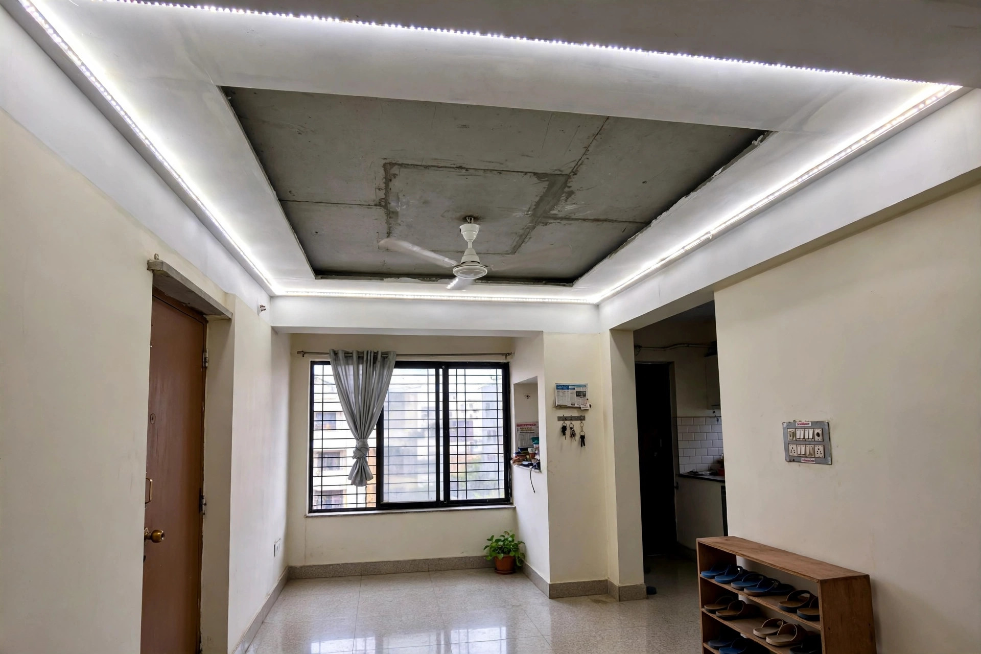 Hall with a gypsum perimeter border and painted exposed centre