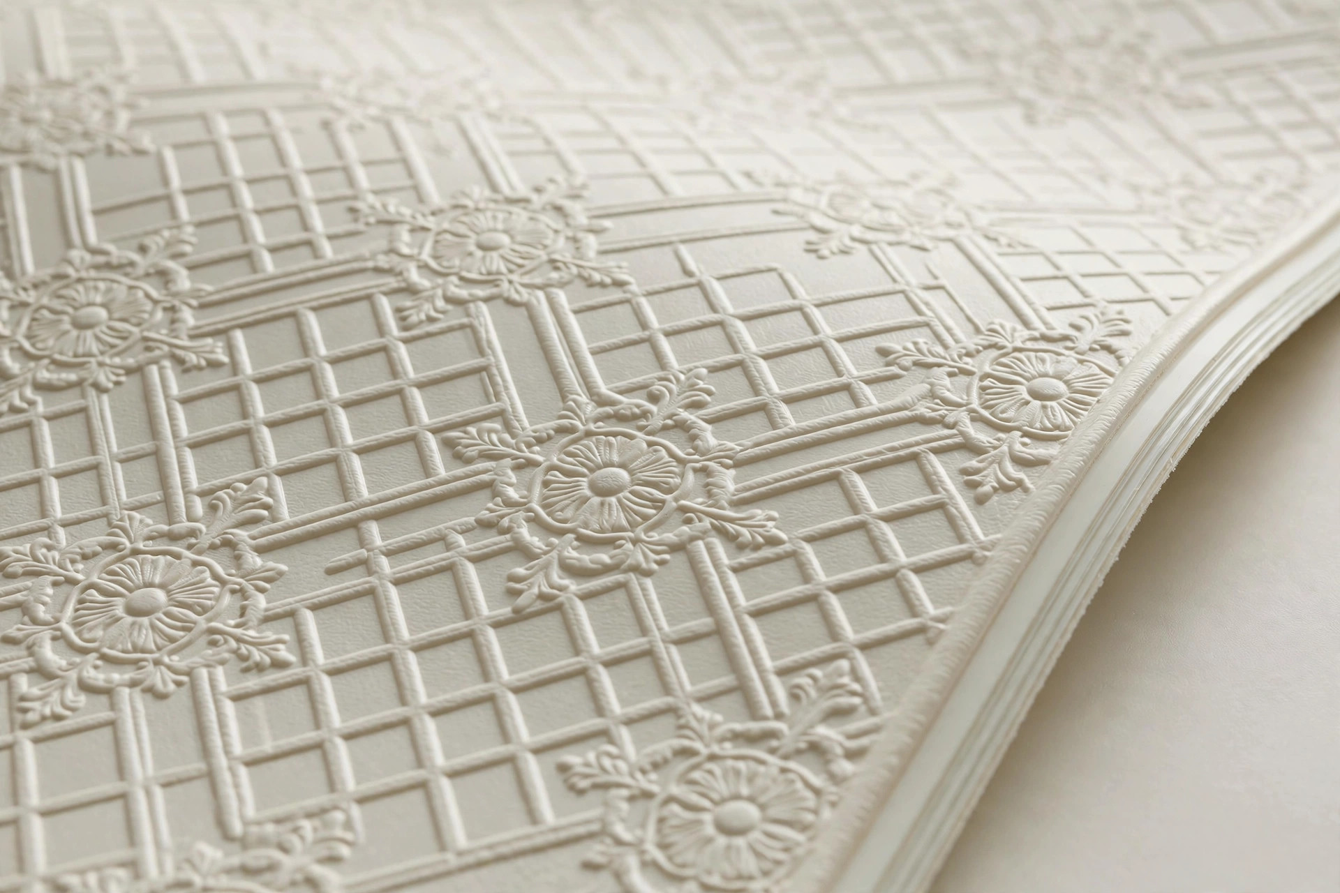 Close view of laminated designer PVC panels with an embossed pattern on a hall ceiling