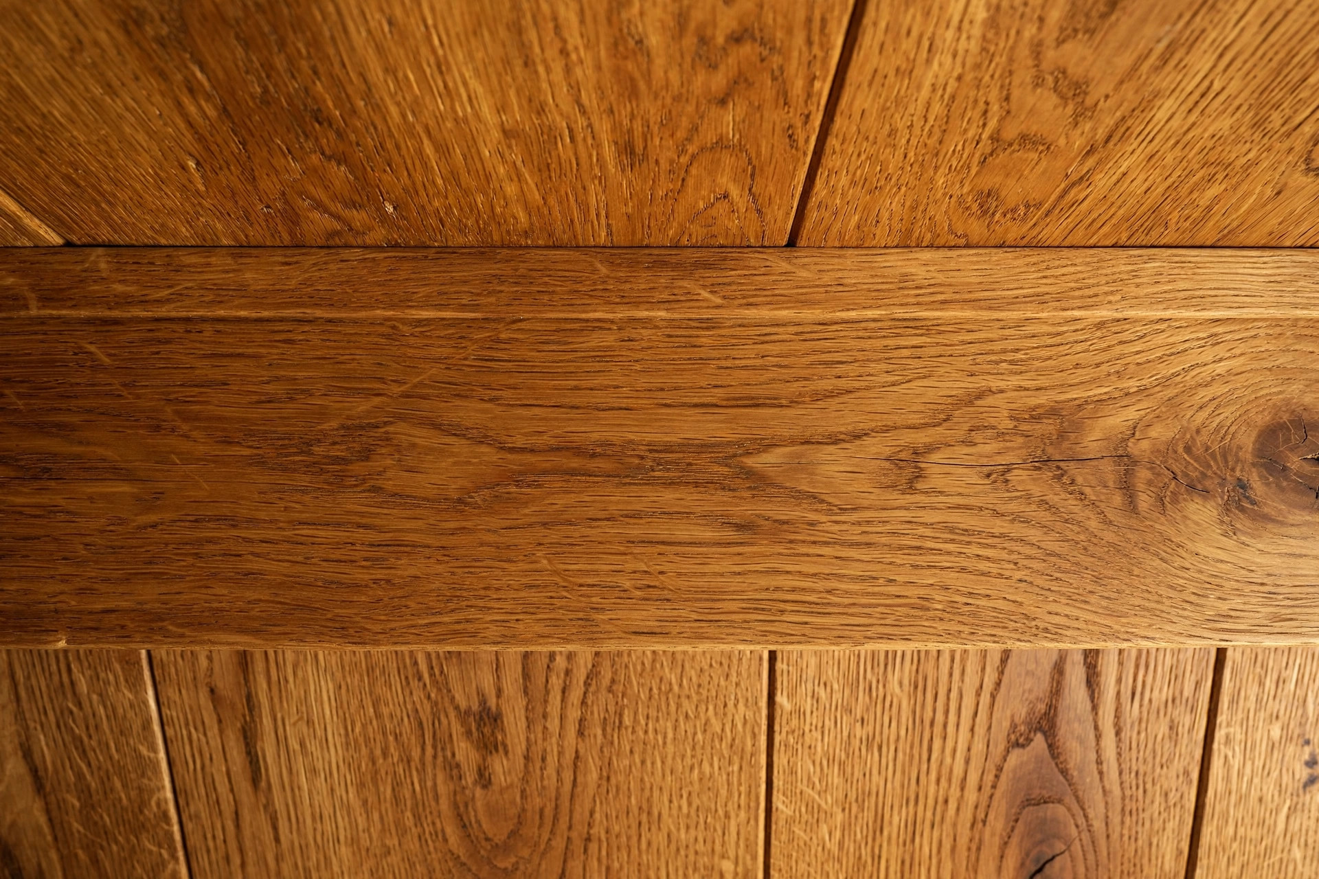 Close-up of wood grain texture on a hall ceiling panel