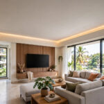 Indian hall with a simple flat false ceiling and warm cove lighting