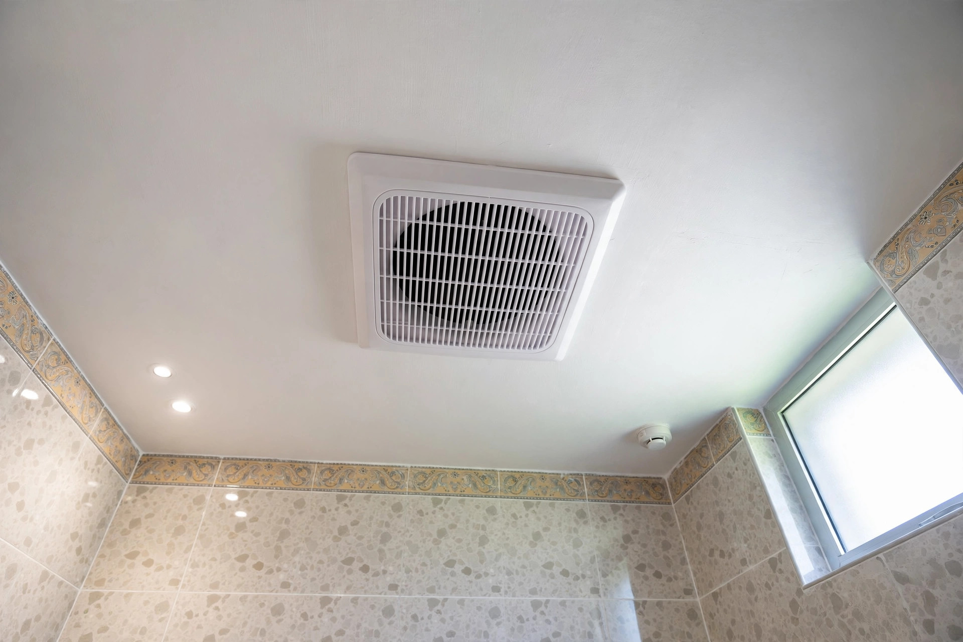 Small bathroom with a properly ducted exhaust fan in the ceiling