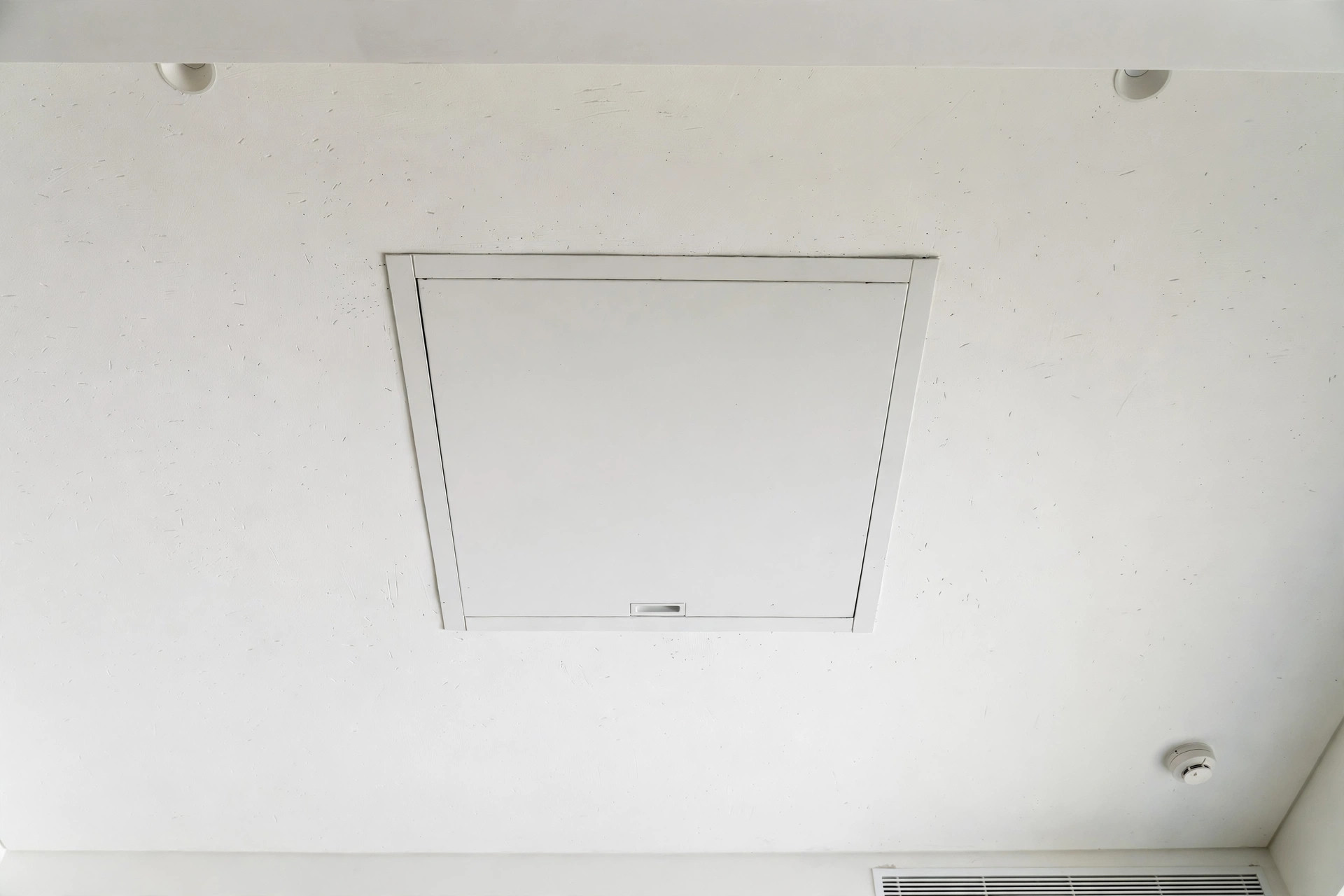 Flush access panel installed in a Gyproc ceiling