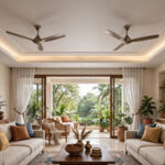 Large Indian living room with two ceiling fans mounted symmetrically in a gypsum false ceiling with cove lighting