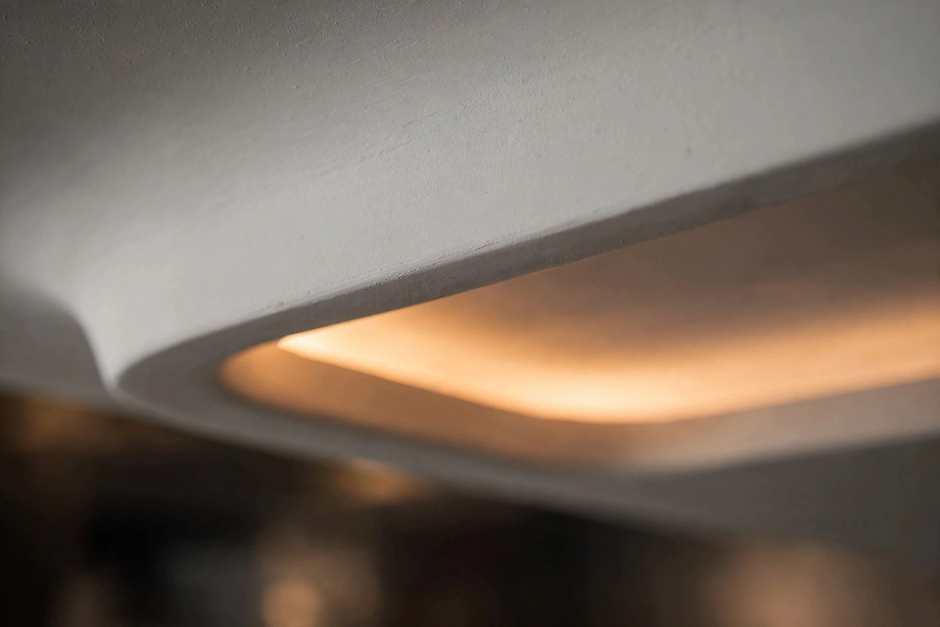 Close-up concept render of a smooth gypsum false ceiling with a concealed cove light channel